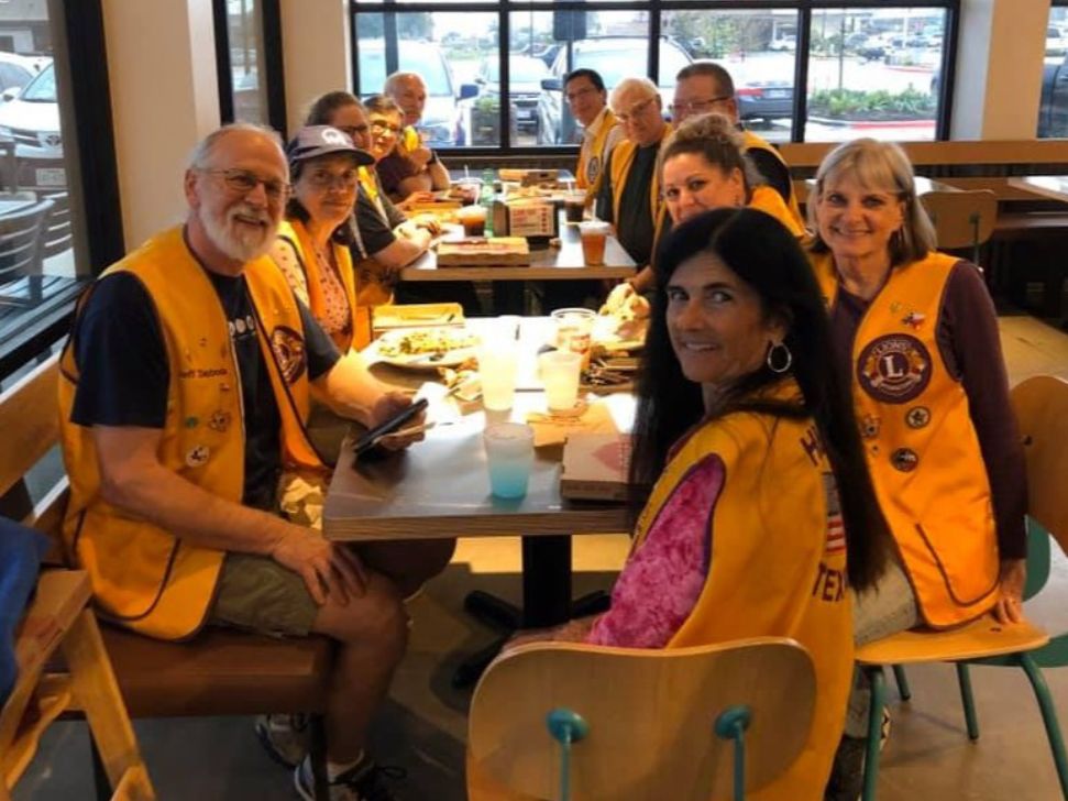 A group of Hutto Lions Club members have lunch together